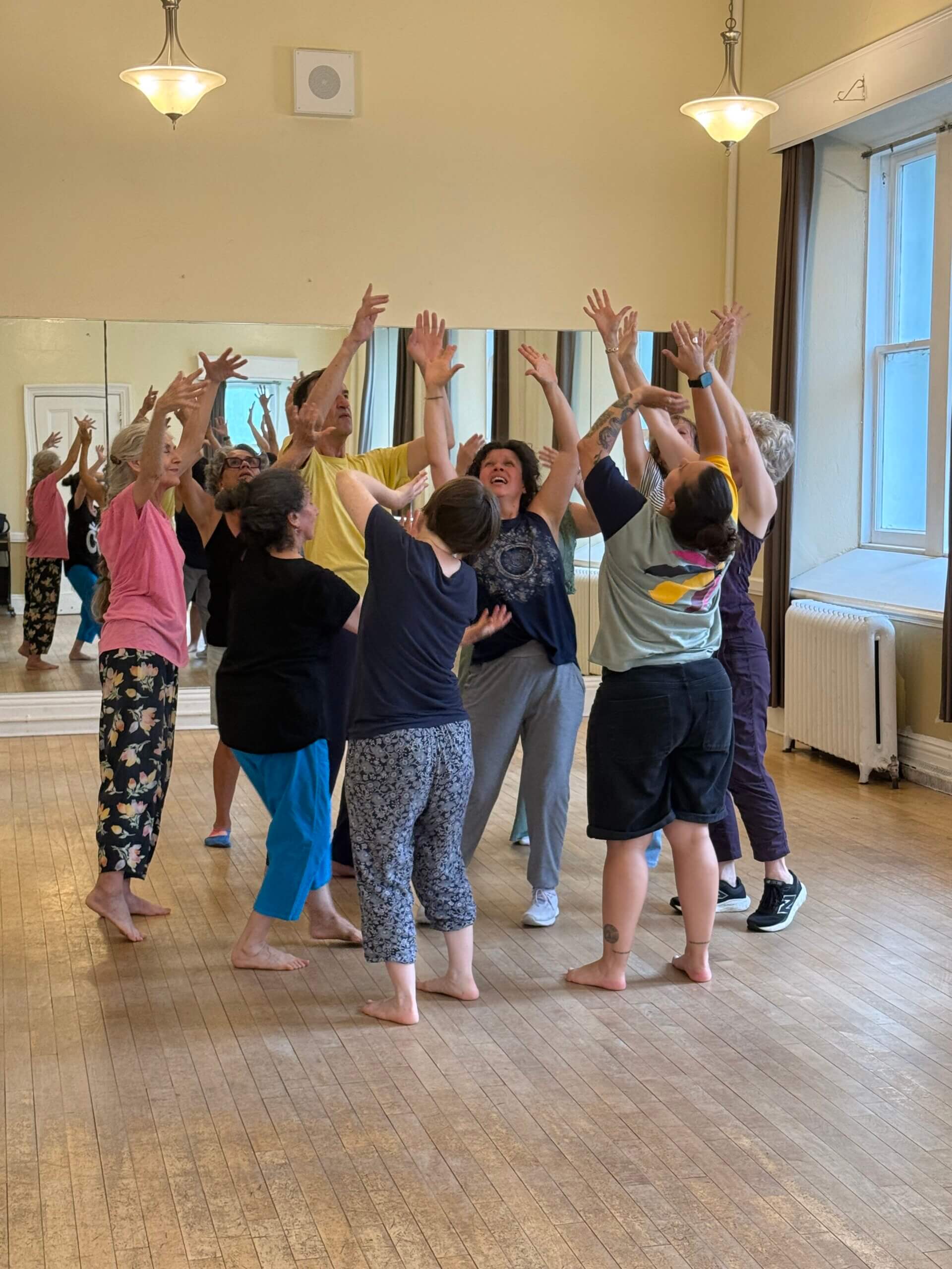 Students dancing Biodanza with Diana Ojeda, expressing emotion through movement.